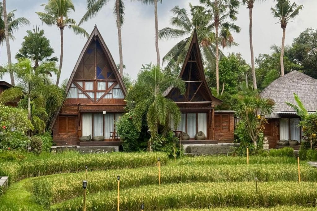 Traditional Balinese villa surrounded by tropical greenery at Menzel Ubud