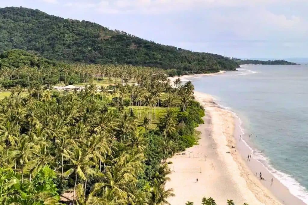 Aerial drone view of Senggigi Beach and coastline in Lombok, Indonesia