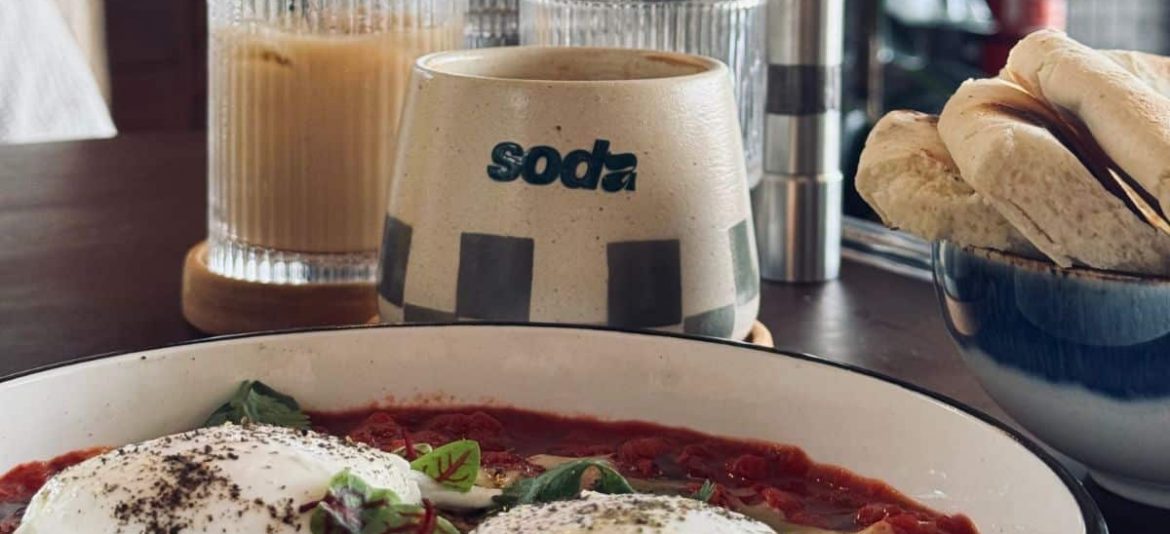 Tropical Breakfast Spread at Soda Colorful breakfast plates with smoothie bowls and toast at Soda café