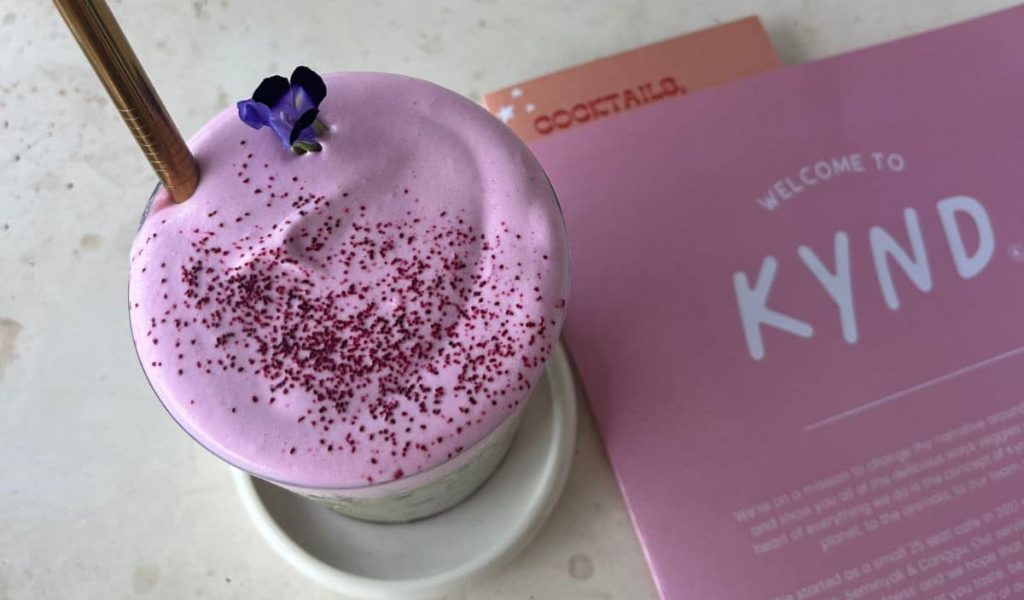 Kynd Community – Matcha & Vibrant Vegan Menu Bright green matcha and colorful menu at Kynd Community.