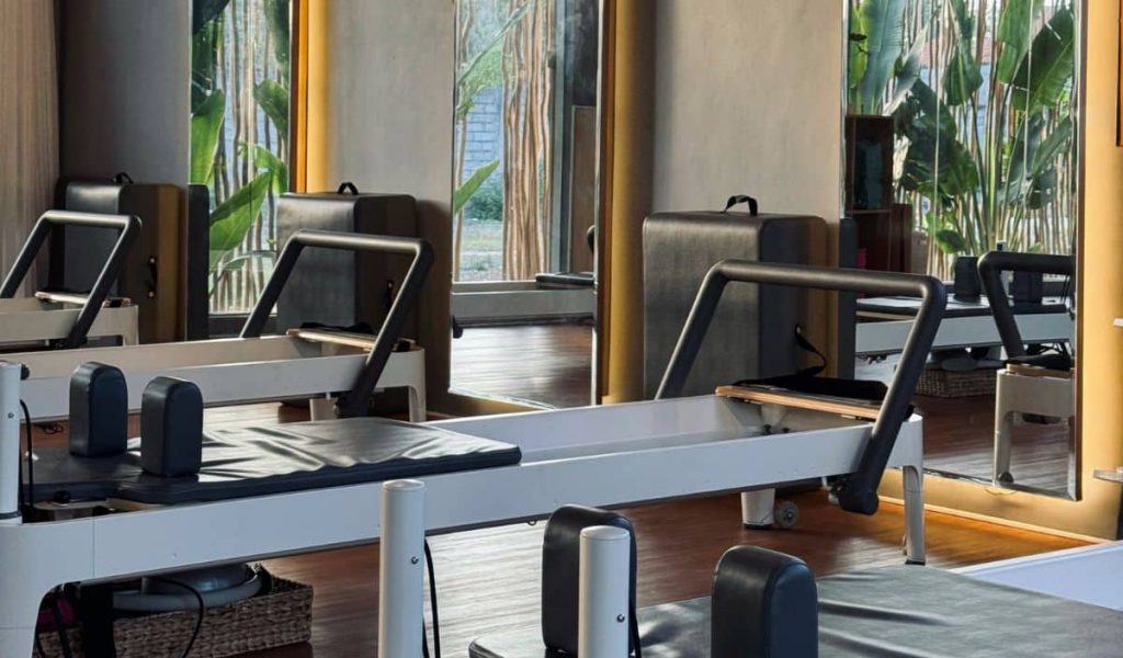 Reform Pilates – Elegant Training Space Reform Pilates studio interior with reformer machines
