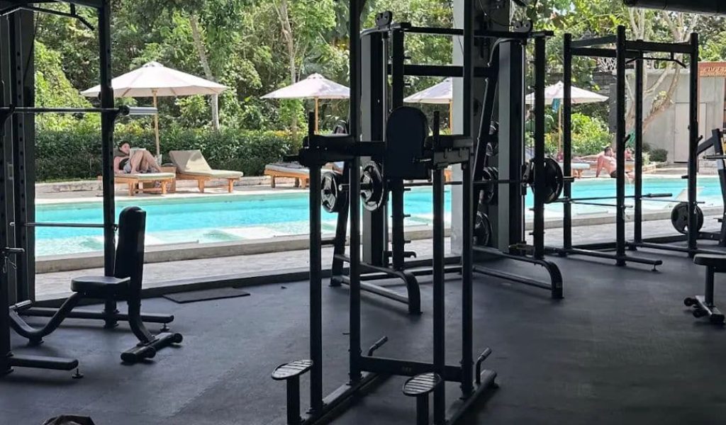 Gym equipment overlooking the pool at Kanana Village Uluwatu.