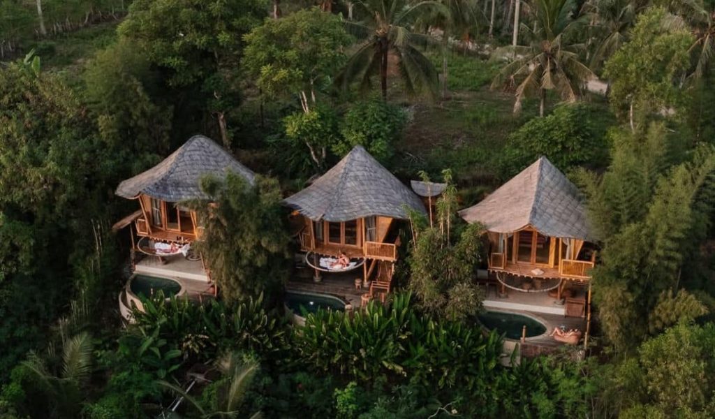 Kalma Bamboo Eco Lodge – Aerial Villa View Aerial view of bamboo villas at Kalma Eco Lodge in nature