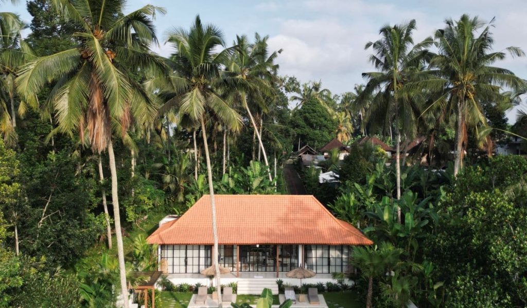 Villa Lestari – Modern Villa with Pool in Uluwatu Front-facing aerial view of Villa Lestari with private pool and garden