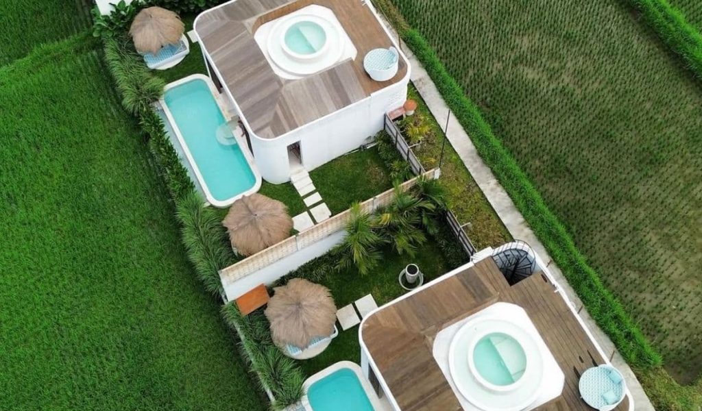 Woy Woy Escape – Private Villas in Nature from Above Aerial drone view of private villas surrounded by tropical landscape at Woy Woy Escape