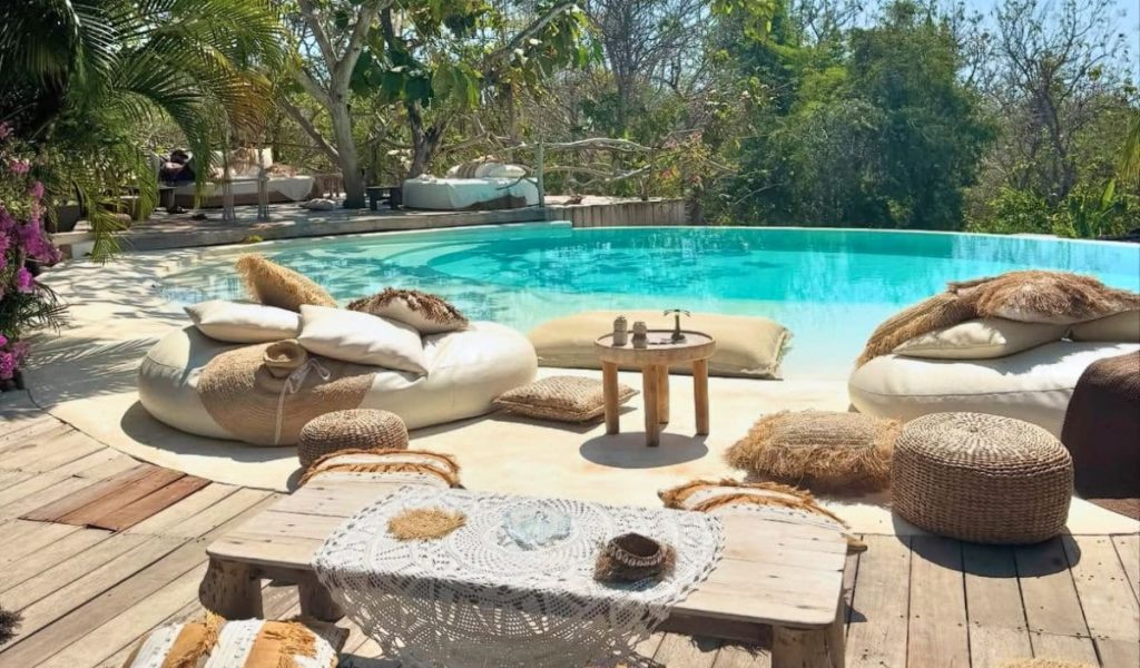 Rustic Outdoor Ambience at La Cabane Outdoor view of La Cabane boutique hotel with rustic wooden bungalows